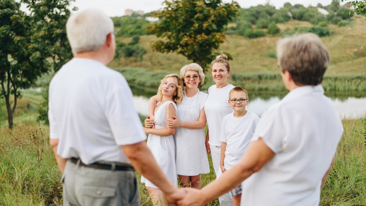 a group of people standing in a field